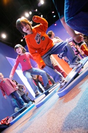 children enjoying the Adventures in Action exhibit